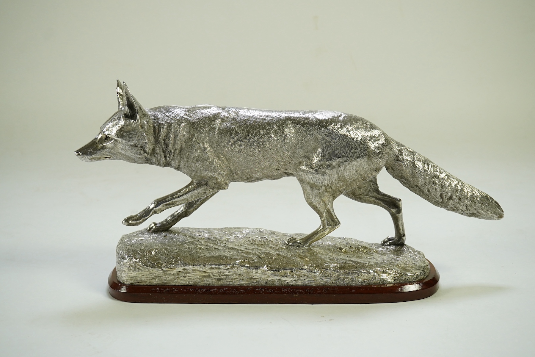 An impressive Victorian silver sculpture of a fox en passant, by R & S Garrard & Co (Robert Garrard II)